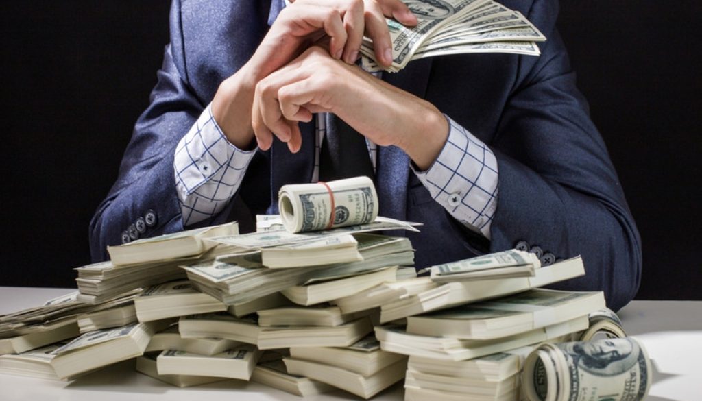 Man,Holding,Money,In,Hand,At,Black,Background,,Man,Receive
