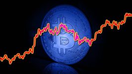 الإقبال الجامح على العملات المشفرة جرس إنذار للأسواق العالمية